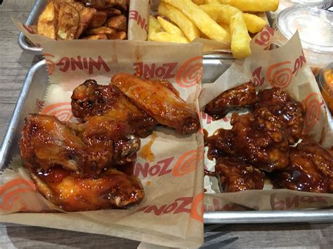 Wing zone wings - Specialties: Wing Zone is where you go for wings, boneless wings, & tenders. All delivered fast. Really fast, and full of flavor. Get your favorites in your choice of 18 different flavors, sides of fries, and even funnel cake fries for dessert. Order online for pickup or delivery today!